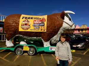 My sweet boy! His eyes are closed because he is embarrassed to stand in front of the big bull. I thought it was because of the sun.