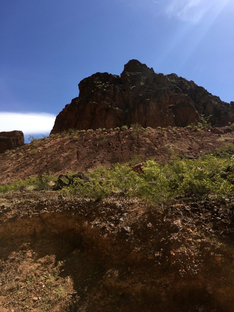 and tall rocks on the right.